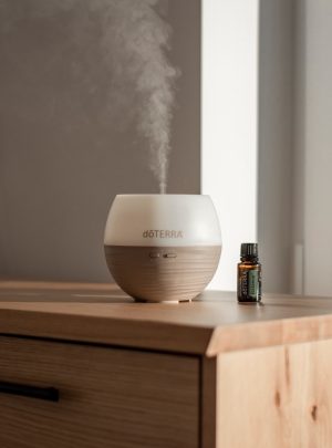 a humidifier sitting on top of a wooden dresser